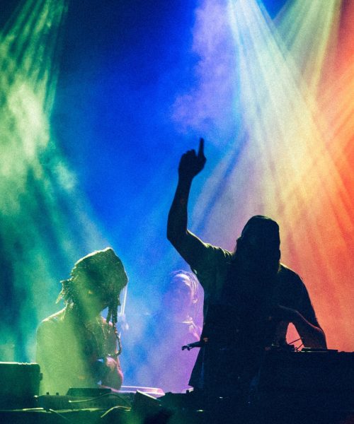 silhouette-of-dj-playing-with-colored-lights-.jpg